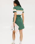 A person viewed from the back wearing a green dress with short sleeves and a round neckline. The dress has horizontal white and yellow stripes on the upper part.