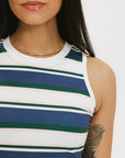A close-up of a person wearing a sleeveless tank top with horizontal blue and green stripes.