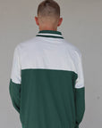 "Close-up of the 'Hamilton Quarter Zip' from the Royal Collection, inspired by autumn hues. This men's quarter zip features complementary color blocking and a convenient zip for easy wear. Made from breathable material, it offers warmth and freedom of movement, ideal for the course and elevating your fall wardrobe with both style and functionality."