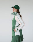 A person wearing a green Elle Rain Jacket with a matching green hat, standing against a white background.