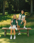 TWO models wearing a color-blocked puffer vest in black and green.