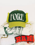 Green cap with 'FORE' text on a white background