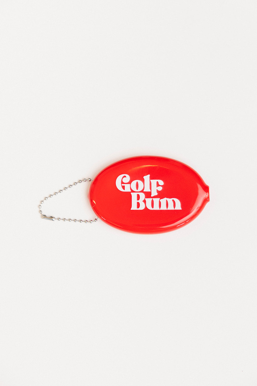 Red oval keychain with 'Golf Bum' text on a white background