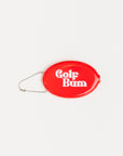 Red oval keychain with 'Golf Bum' text on a white background