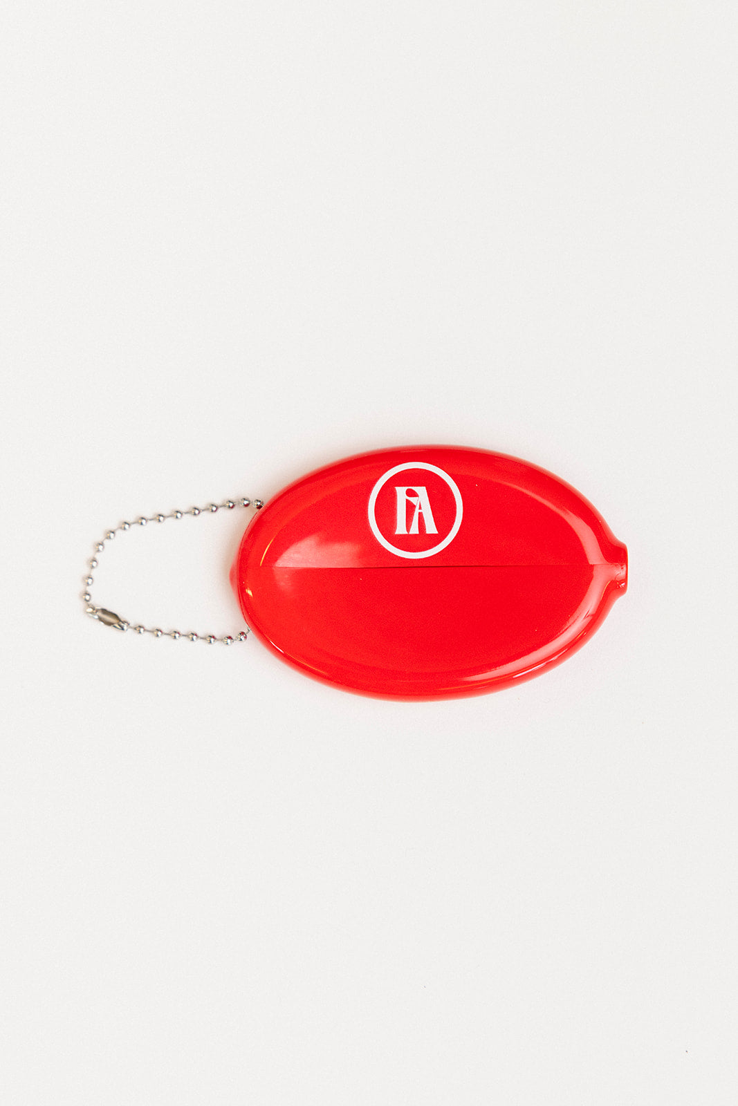 Red oval keychain with 'Golf Bum' text on a white background