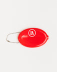 Red oval keychain with 'Golf Bum' text on a white background