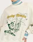 Sweater with graphic design and text on a plain background