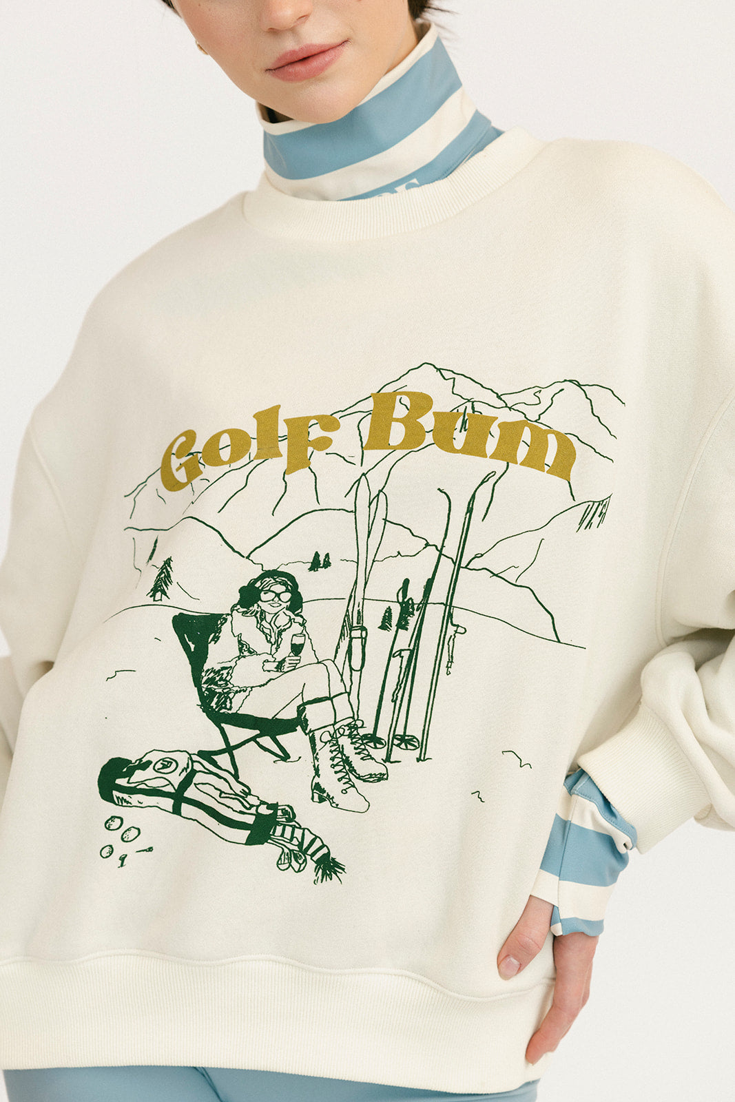 Sweater with graphic design and text on a plain background