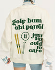 Person wearing a jacket with 'golf bum ski patrol' text and graphics on the back.