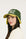 Person wearing a green and avocado cap with 'FORE' on a white background