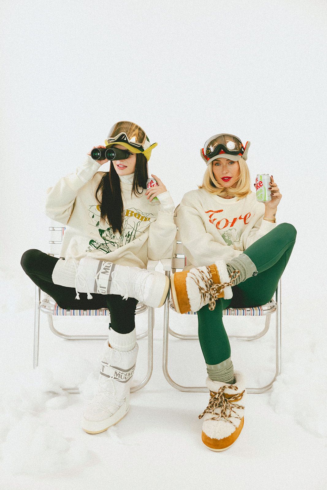 Two people sitting on chairs wearing stylish outfits with accessories.