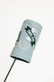 Smoke blue Kai golf club head cover with a logo on a white background