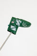 Green golf club head cover with decorative patterns on a white background