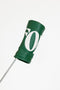 Green golf club head cover with a white logo on a white background