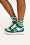 Green and white sneakers with checkered socks on a white background
