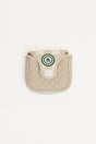 Beige quilted mallet cover with a green logo on a white background