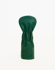 Green golf club head cover on a white background