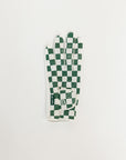 Green and white checkered glove on a light gray background