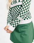 Woman wearing a green and white checkered Fore Sweater with 'FORE' text on a white background