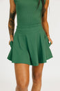 Green manhattan skirt worn by a person on a white background