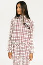 Woman wearing a merlot and white plaid Lyla Jacket on a plain background