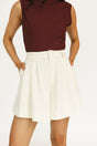 Person wearing a burgundy sleeveless Manhattan top and an angora Eleanor short on a plain background