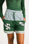 Green Fletcher athletic shorts with Fore All logos on a plain background