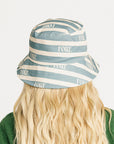 Person wearing the Fore All Austi Bucket Hat with a green sweater with a logo