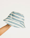 Blue and white striped bucket hat with 'FORE' branding on a light gray background