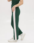 A pair of green Simone Pant with white stripes on the side, front and back pockets, and a zipper fly with snap closure.