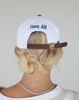 Close-up of the 'Weirsy Hat' from the Royal Collection, inspired by autumn hues. This hat retains the coveted fit of the best-selling Fore Hat but adds a vintage feel with an '04' patch. Combining classic style with an updated design, it's a must-have accessory for any golf enthusiast.