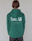 "Close-up of the 'Global Hoodie' from the Royal Collection, inspired by autumn hues. This cozy, slightly oversized hoodie features a substantial pocket for golf and personal items and a full-coverage hood. 'Fore All' details on the front and back include the classic 'Golfing Optional' phrase in five languages. Perfect for combining comfort and global style this season."