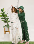 Two models wearing matching icon outfits both in green and white