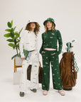 Two models wearing matching icon outfits both in green and white