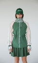 A person wearing a green Elle Rain Jacket with a matching green hat, standing against a white background.