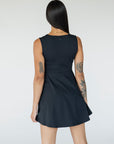 Woman wearing a black sleeveless dress on a white background